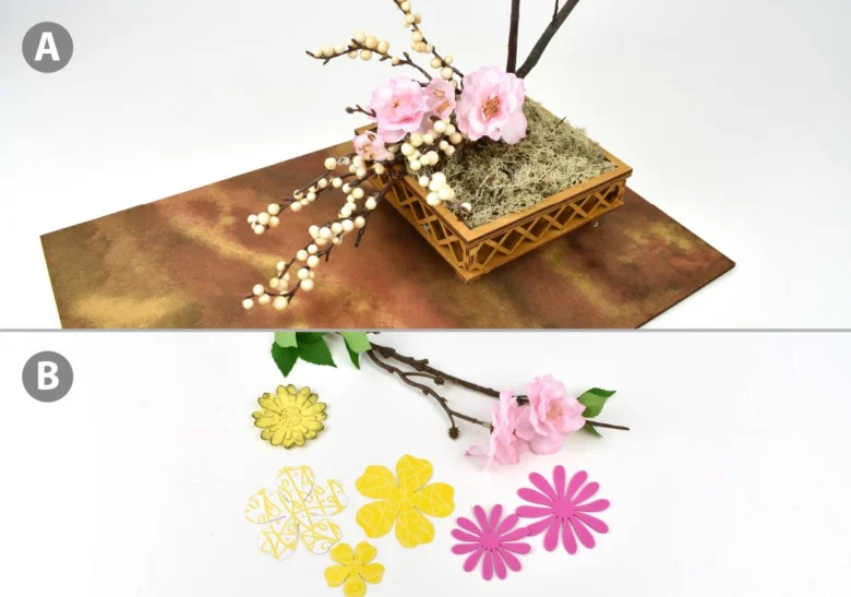 Japonská aranžace květin ikebana s papírovými prvky.