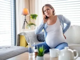 Pregnant woman on phone