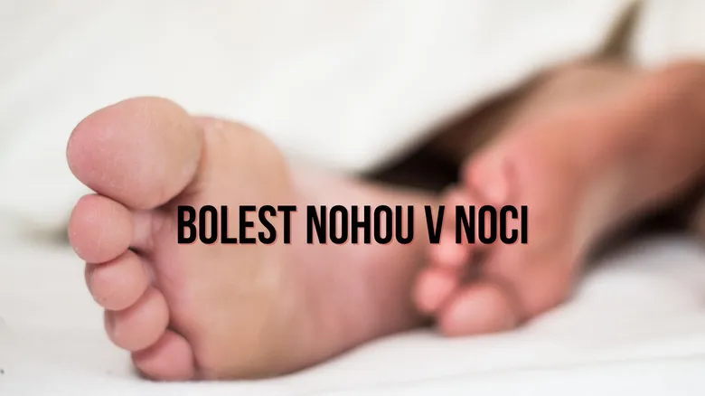 Bare human feet on bed illustrating night leg pain topic.