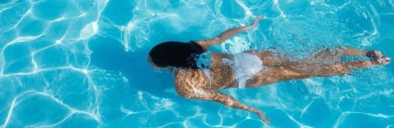 Woman swimming in pool