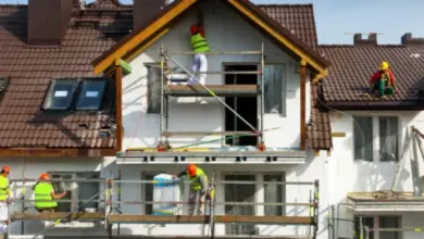 House renovation workers on scaffolding