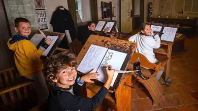 Children drawing in monastery schoolroom