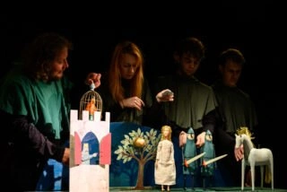 Puppet theater scene with otesánek characters