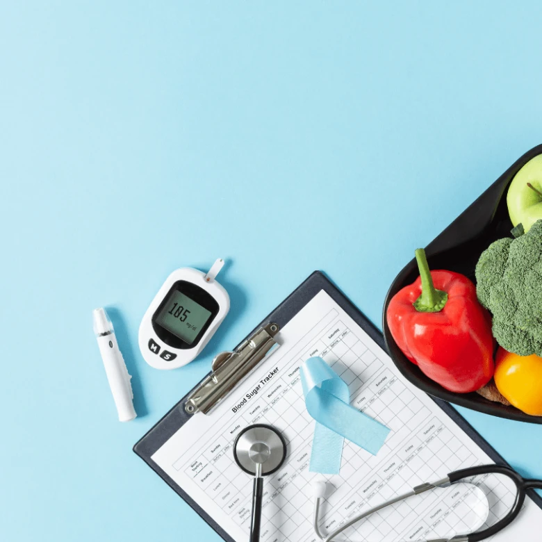 Glykovaný hemoglobin měření s glukometrem, zdravou stravou a zdravotnickými pomůckami.